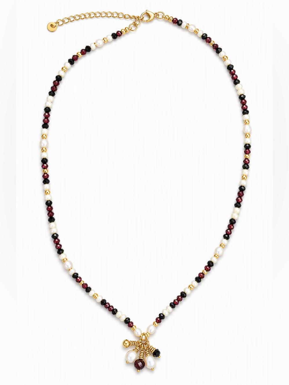 Multi-gemstone necklace with raw ruby pendent.